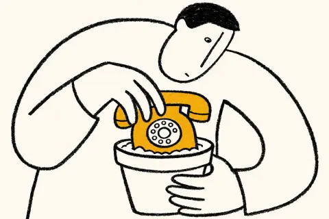man planting a telephone in a flower pot