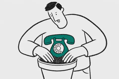 man planting a telephone in a flower pot